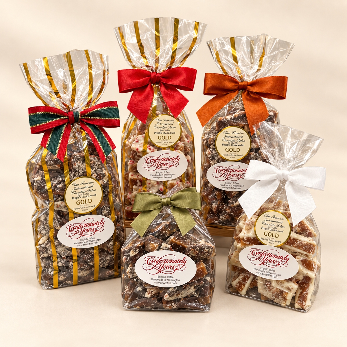 Confectionately Yours English toffee in various flavors displayed to show both classic and holiday gift bag options gifting options